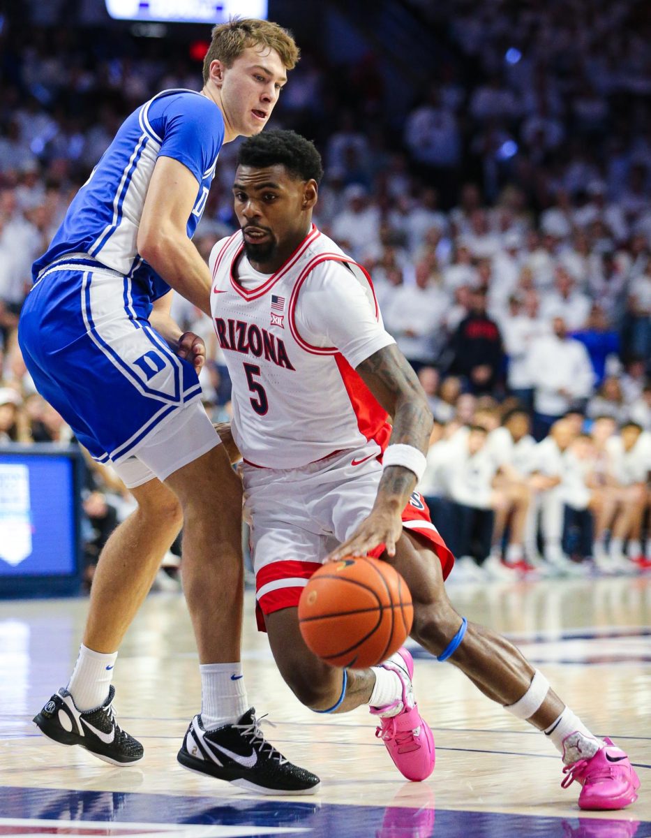 KJ Lewis navigates into the paint against Cooper Flagg at the University of Arizona's home matchup against Duke in McKale Center on Nov. 22. Lewis tied Love for the worst +/- in the game.