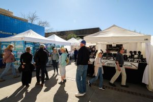 Community members walk around the Tucson Museum of Art’s Fall Artisan Market. Vendors from across Tucson set up stands selling items that range from pottery to jewelry. (Courtesy Julius Schlosberg 2023)