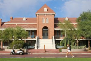 A student walks to class in front of Old Main on Oct. 9 at the University of Arizona. 