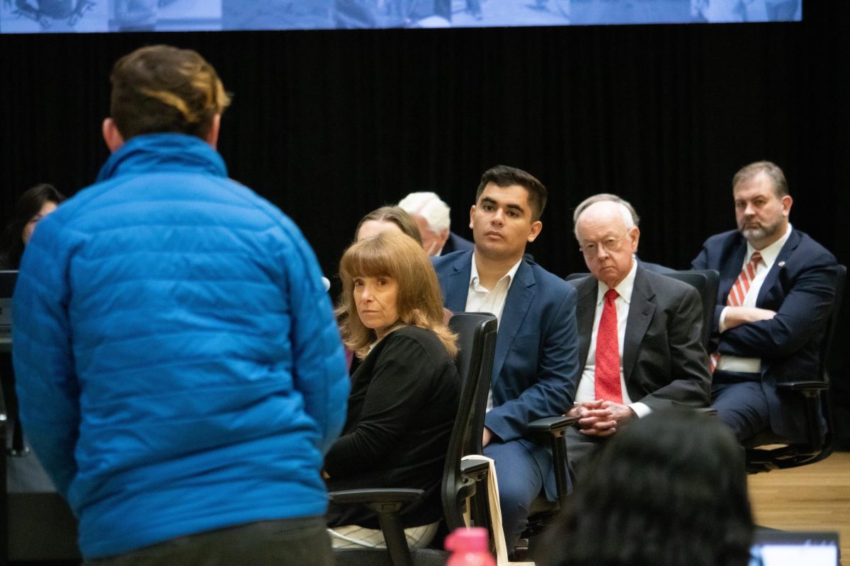 The Arizona Board of Regents listen to a student during a call to the audience on Nov. 21.