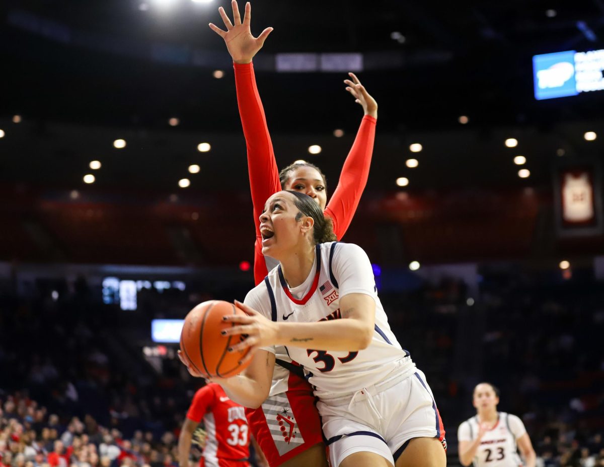 Isis Beh drives in on Alyssa Brown in McKale Center on Nov. 12. Beh transferred from West Virginia in 2023.