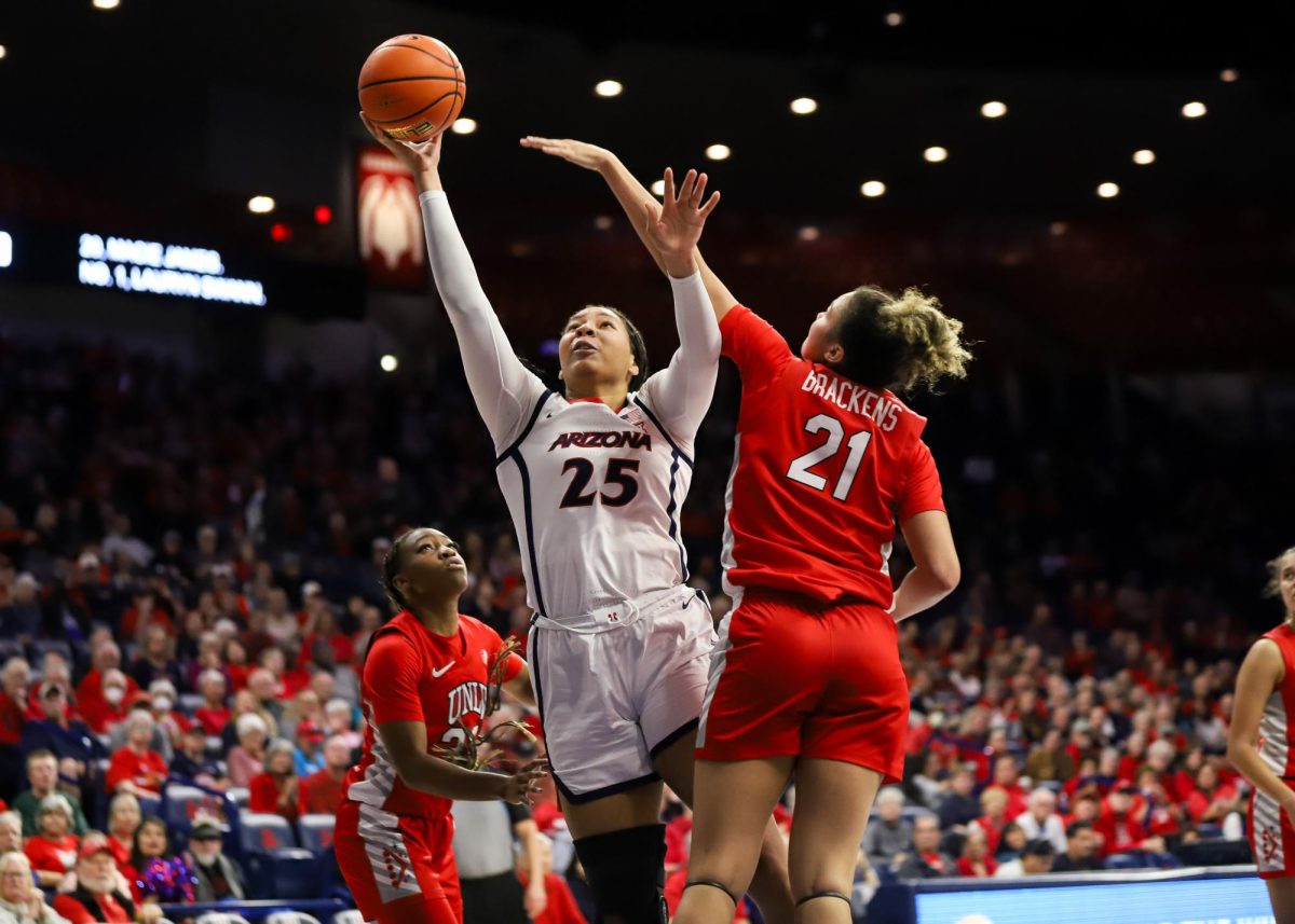 Breya Cunningham goes for a layup against 2 UNLV defenders in McKale Center on Nov. 12. There were six lead changes during the game.