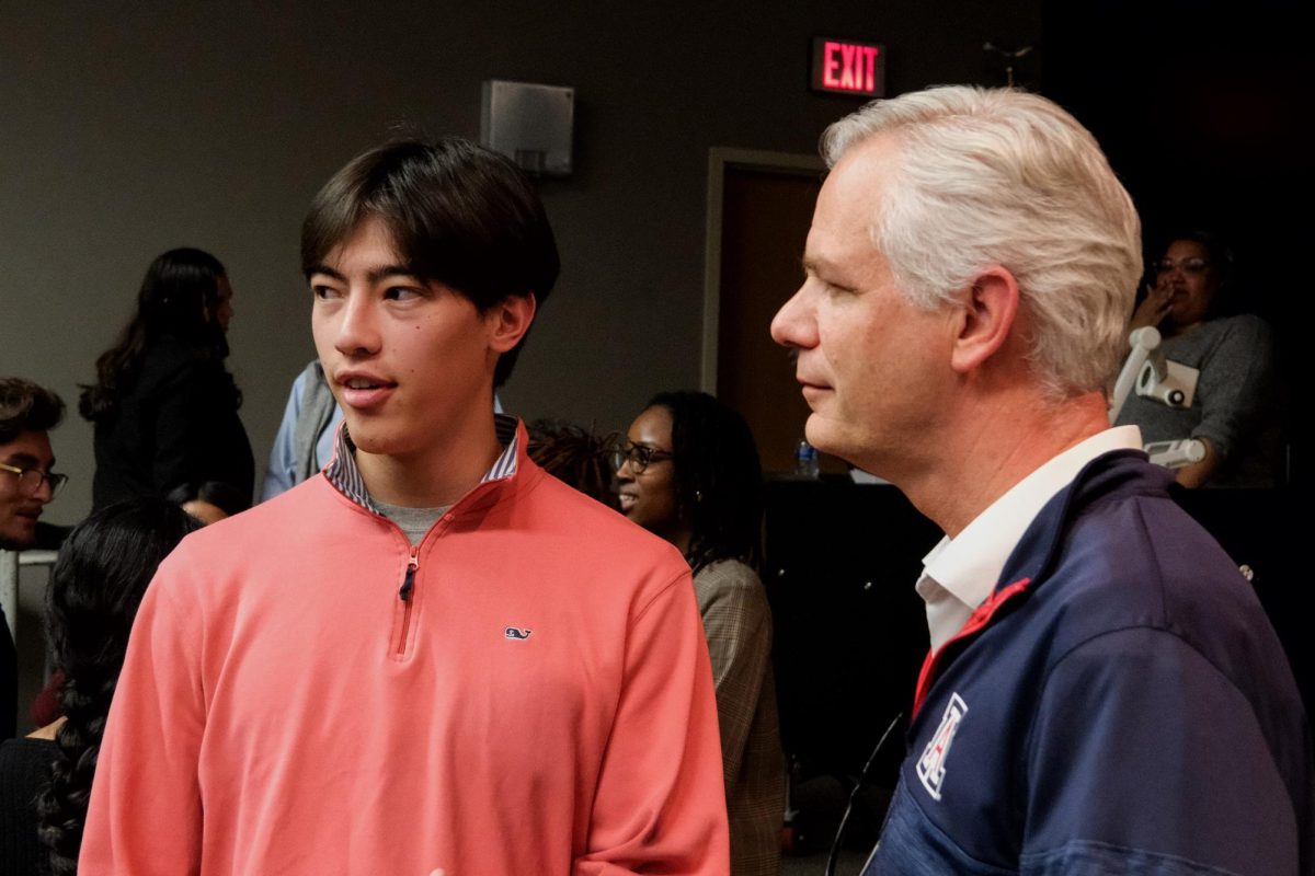 John Arnold speaks to Eric Pineda after the ASUA town hall on Nov. 20 in Gallagher theater. Many students took time after the meeting to voice their concerns personally. 