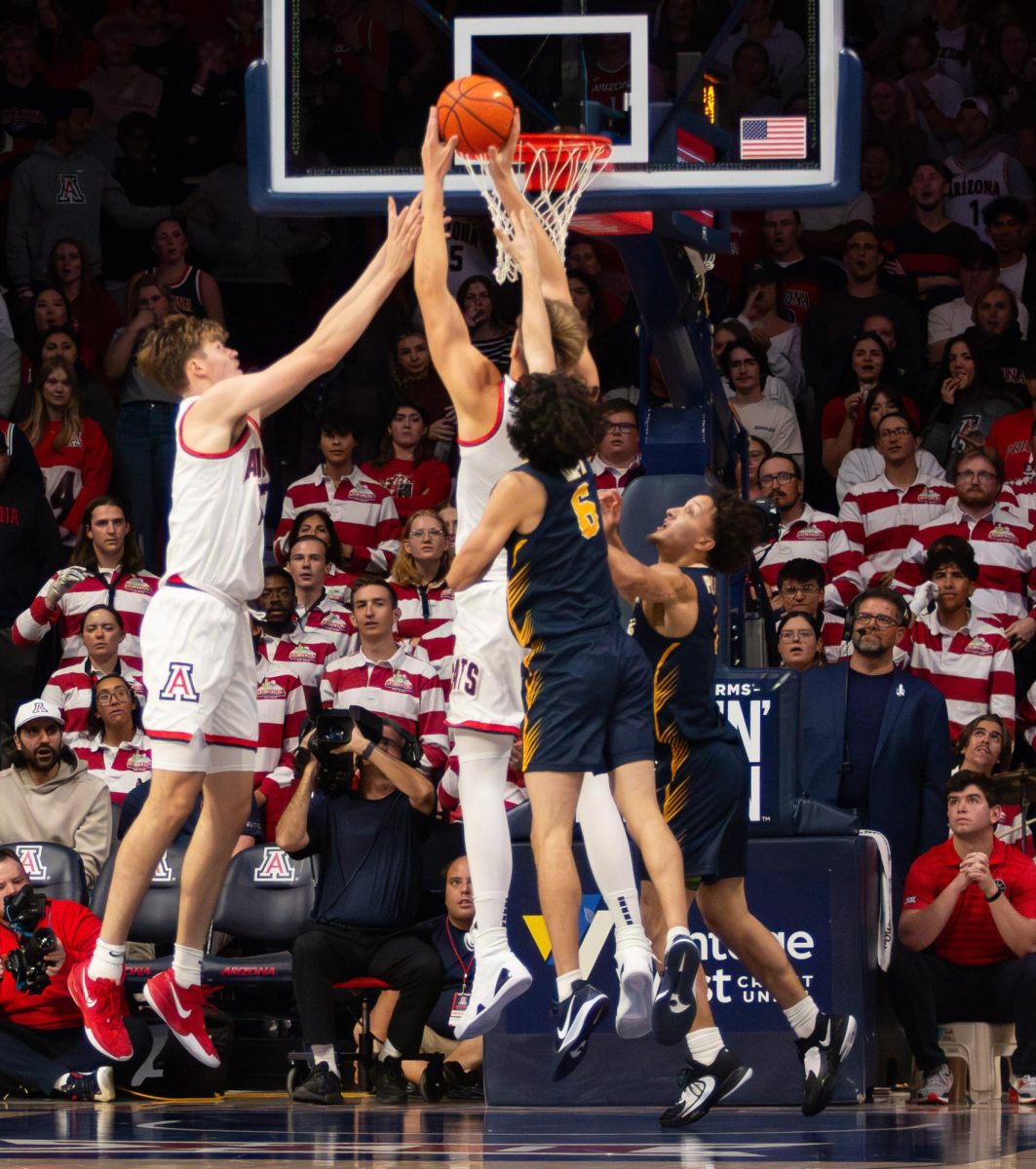 University of Arizona basketball players jump for the basket during the Wildcats' game against Canisius on Nov. 4. The Wildcats maintained their early lead to a 93-64 final score.