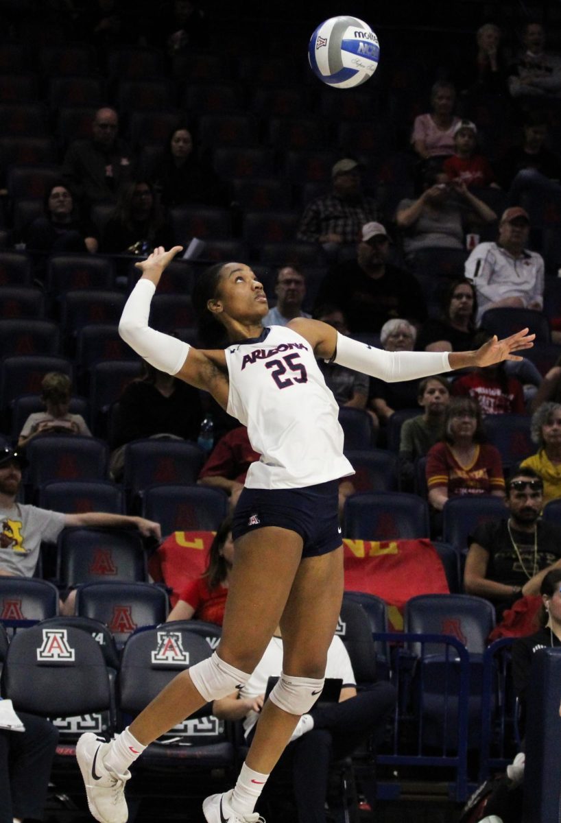 University of Arizona volleyball player Kiari Robey sets the ball on Nov. 23 in McKale Center against Iowa State University. Robey is a middle blocker and a senior.