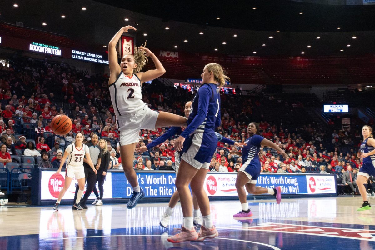 Jada Williams of the Arizona Wildcat’s women’s basketball team loses the ball while charging for a layup during the Wildcats’ game against the Weber State Wildcats on Dec. 16 in McKale.