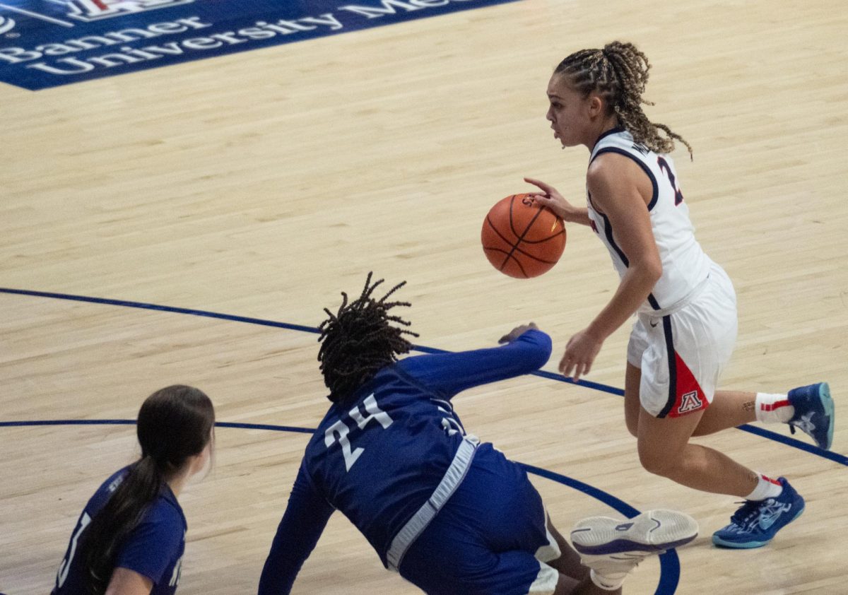 Jada Williams rushes past a Weber State player during their game on Dec. 16 in McKale. Williams had a career high game with 24 total points.