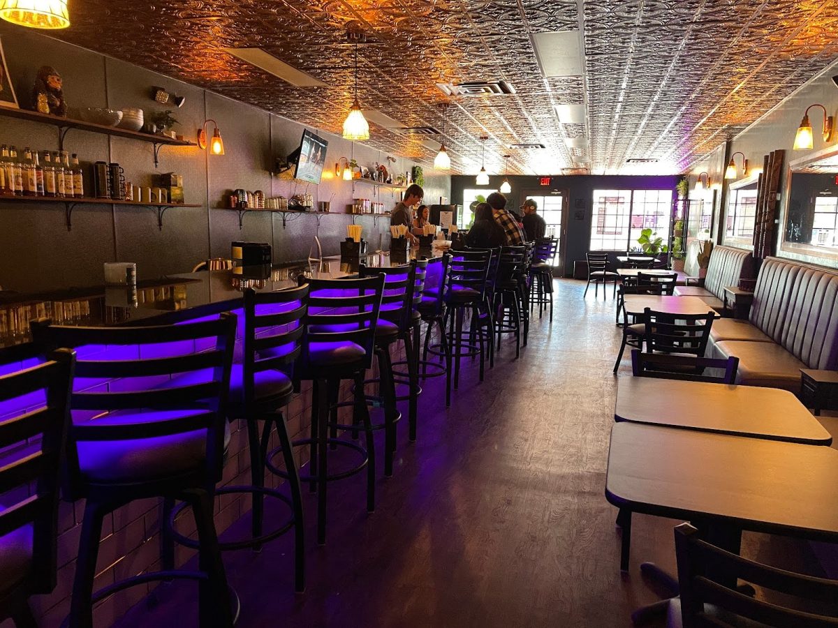 Bartender Ben Caspary and co-owner Whitney Marx serve customers at the Kava Den a few hours after opening on Nov. 9. While the location looks similar to a bar, the Kava Den does not serve alcohol.