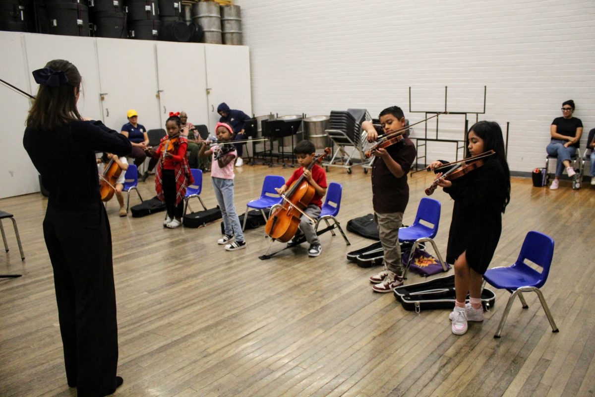 Isabel Burgos-DeStephanis teaches primo-level students at the University of Arizona School of Music on Dec. 7. The school was holding rehearsals for the String Project, which is a teacher training program to teach kids from ages five through 14 where they can learn violin, viola and cello.