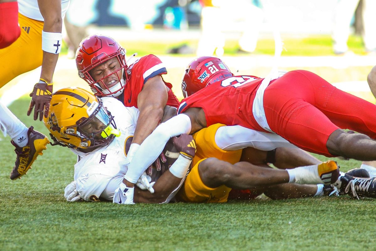 Arizona brings down the ASU ball carrier during the 2024 Territorial Cup on Nov. 30 at Arizona Stadium. Arizona finished the game with only 210, less than a third of ASU's 643 yards.