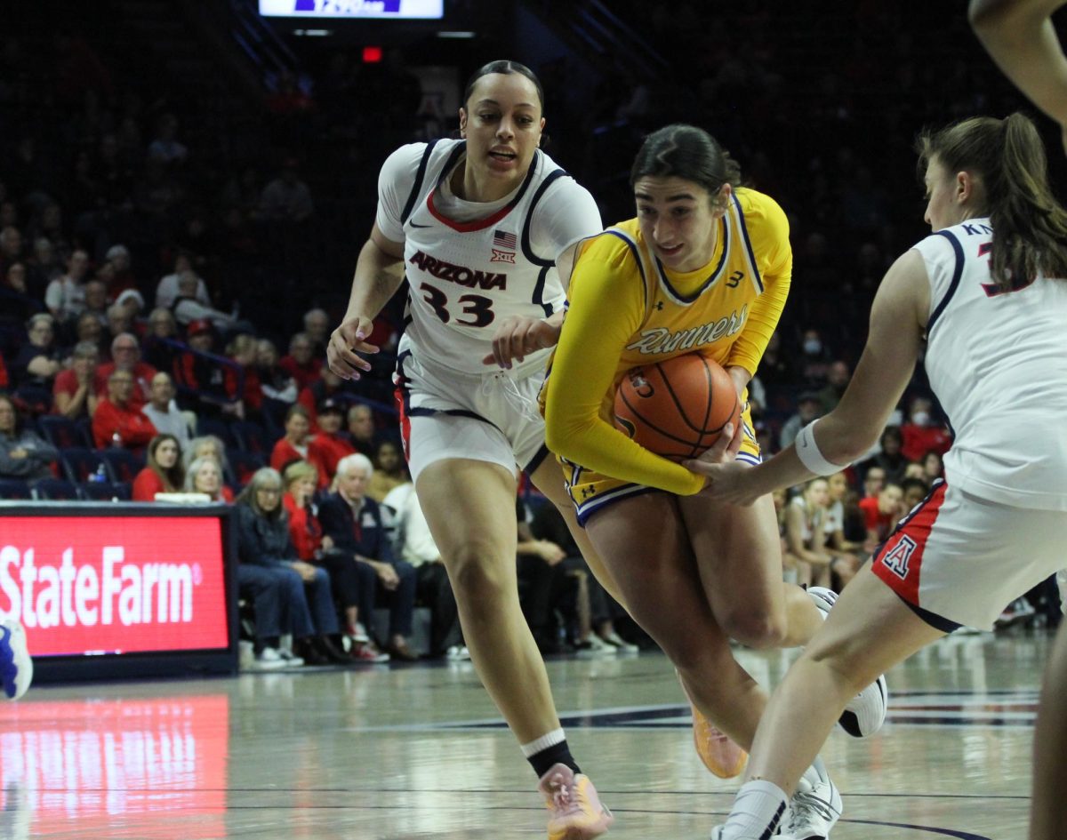 University of Arizona womens basketball player Isis Beh catches up to a California State University, Bakersfield player on Dec. 10 in McKale Center. Beh had 8 points, 2 rebounds and 1 assist during the game. 