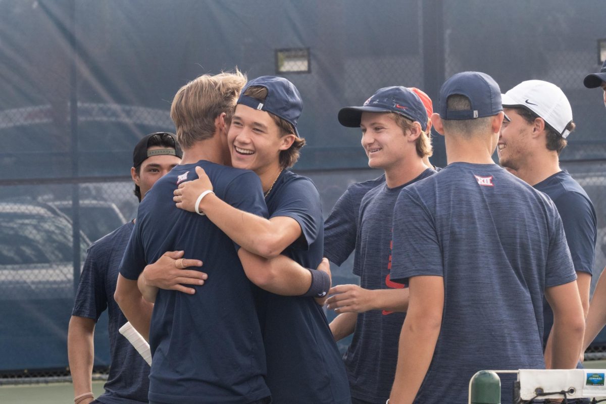 University of Arizona tennis players celebrate a 4-0 win against University of Southern California on Jan. 25 at Robson Tennis Center. The team survived the first day of the tournament and advanced to the second stage on Jan. 26.