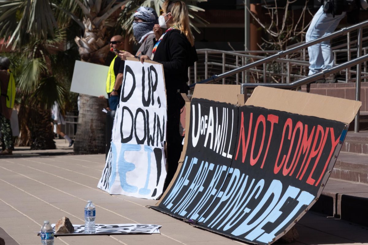 Signs in support of D.E.I are propped up in front of Campus Administration on Feb. 28. The signs demanded that the University keep its D.E.I policies in place.