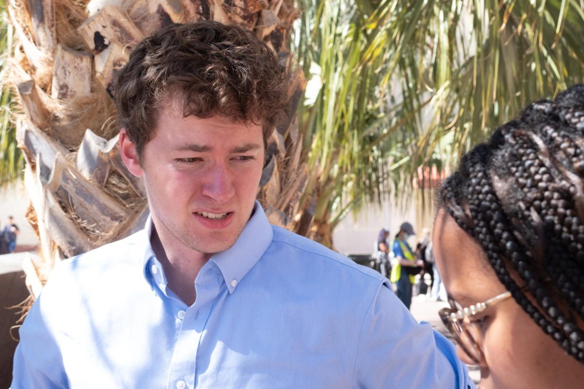 Ben Armentrout, president of UA College Democrats speaks to Kiara Adams of the Daily Wildcat on Feb. 27. Armentrout was one of the organizers of the protest.