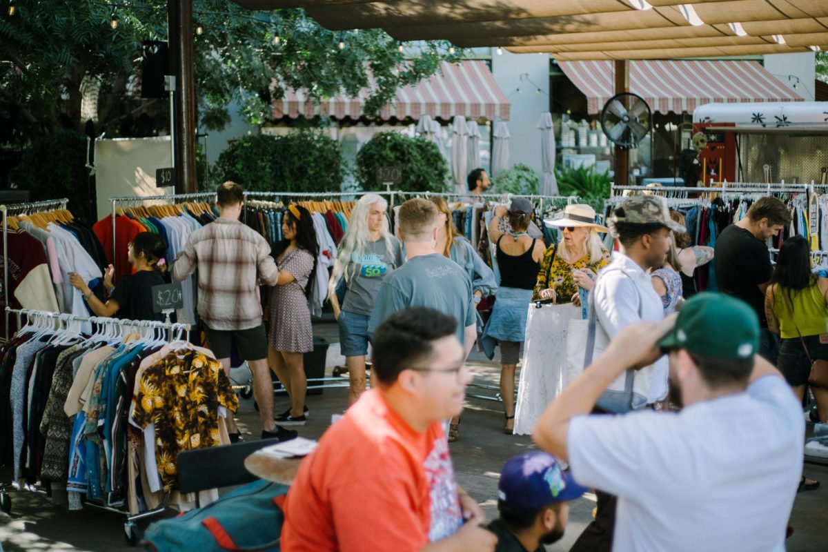 Customers browse vintage clothing racks at Desert Haze on Oct. 21, 2023, at Hotel Congress. The market is held once a month on the hotel’s patio at 311 E. Congress St.  (Courtesy of Katie Burkholder) 