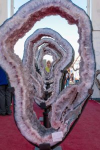 A woman looks through a line of geode rings on Wednesday, Feb. 5, 2025, at the Tucson Gem Show at Kino Sports Complex in Tucson. The Tucson Gem Show is one of the biggest in the world.