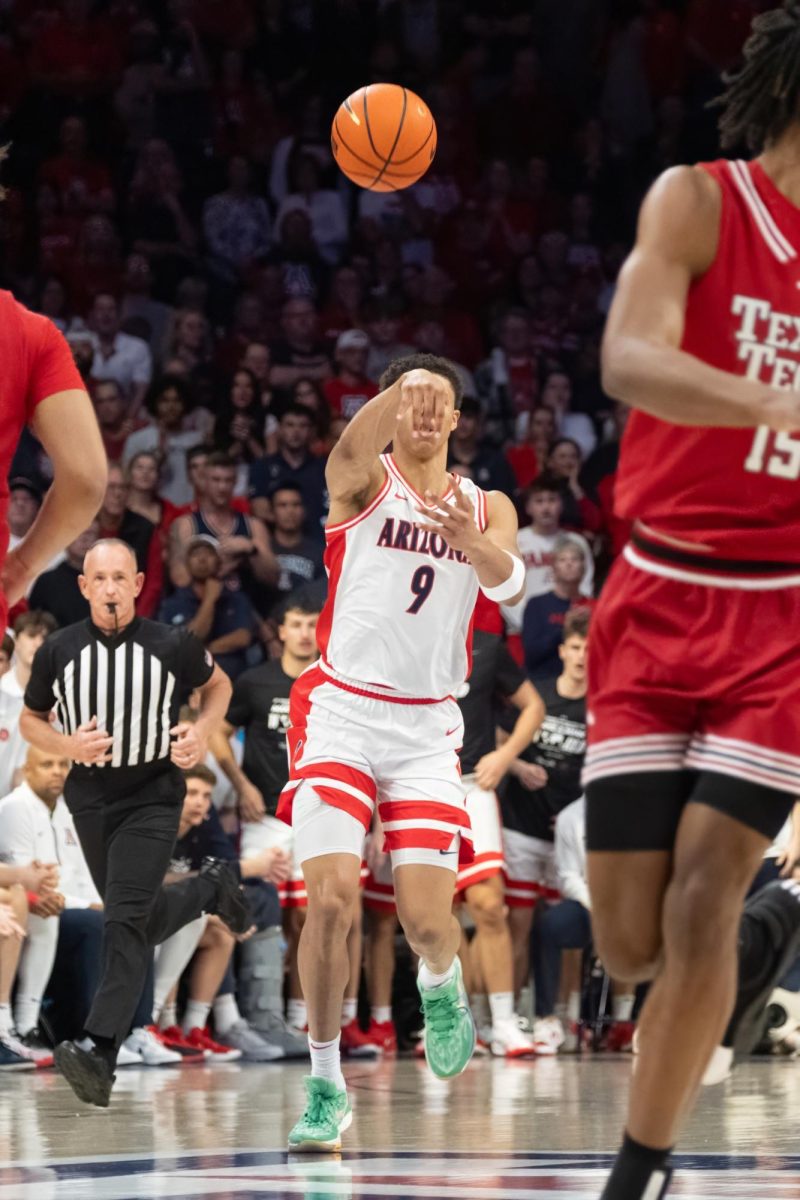 Carter Bryant passes the ball down the court during the Arizona Wildcats game against Texas Tech on Feb. 8 in McKale Center. With a plus/minus of 22, Bryant had the highest of the game.