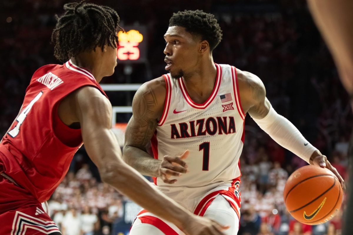 Caleb Love of the Arizona Wildcats looks for an opening while being guarded by Texas Tech's Christian Anderson during their game in McKale Center on Feb. 8. Love played nearly the entire game and had a 16 point game to show for it.