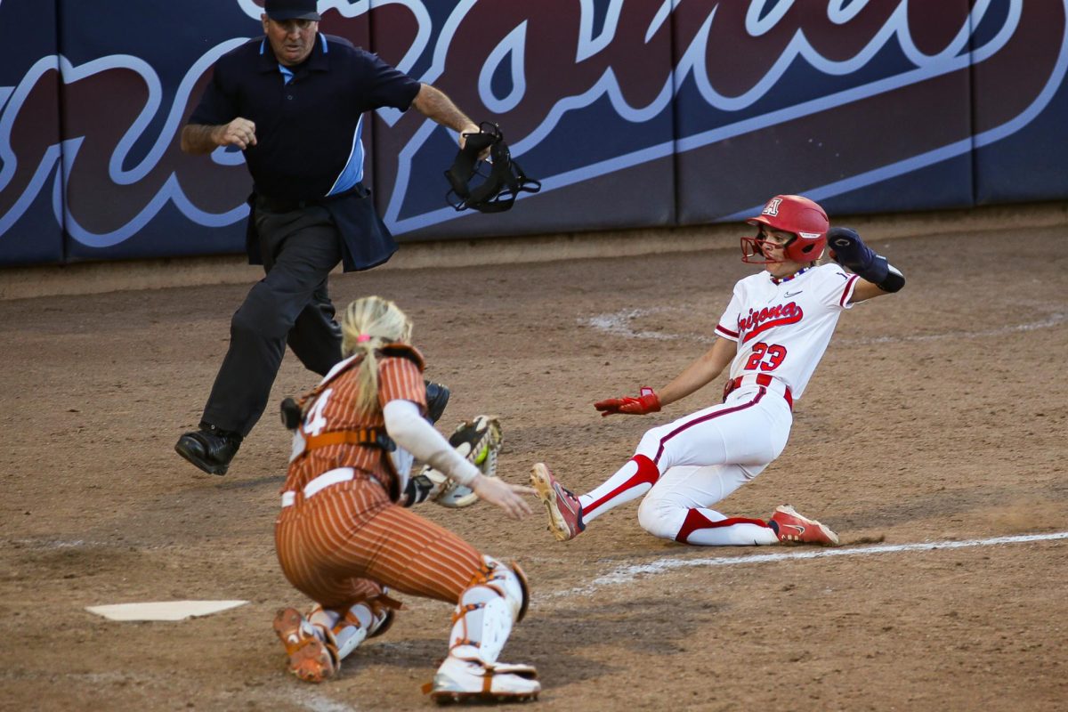 Logan Cole slides into home to tie the game in the bottom of the seventh inning against #1 ranked Texas on Feb. 22 at Rita Hillenbrand Stadium. Arizona only scored in the first and last inning of regulation.