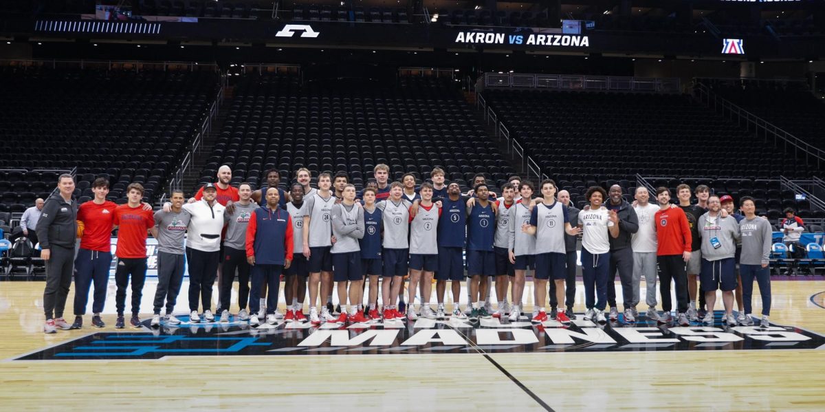 The Arizona Wildcats men's basketball team poses for a group photo during a practice session on March 20 in Climate Pledge Arena in Seattle, Wash. The Wildcats face down Akron in the first round of the NCAA tournament.