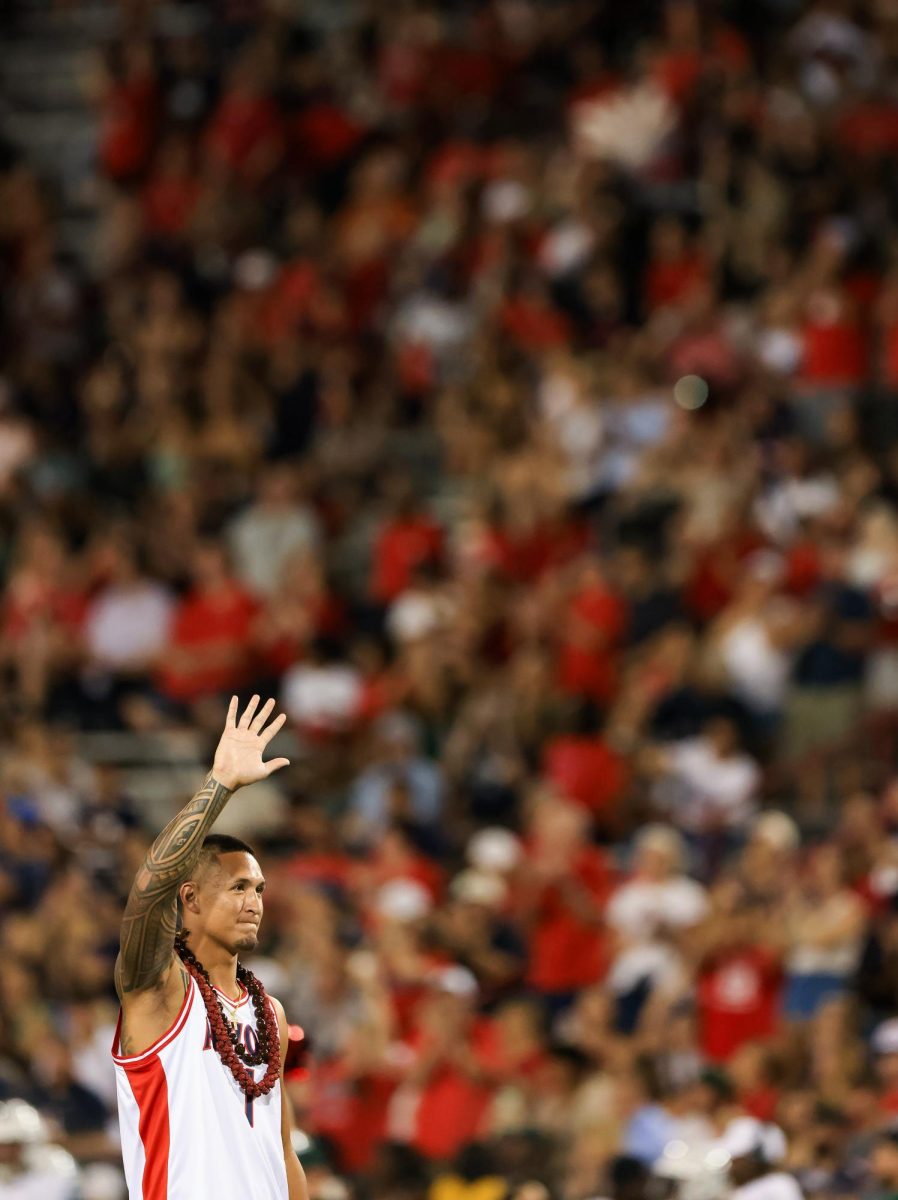 Former Wildcat Tetairoa McMillan waves to the crowd at Arizona Stadium on Aug. 30. McMillan was inducted into the Football Ring of Honor.
