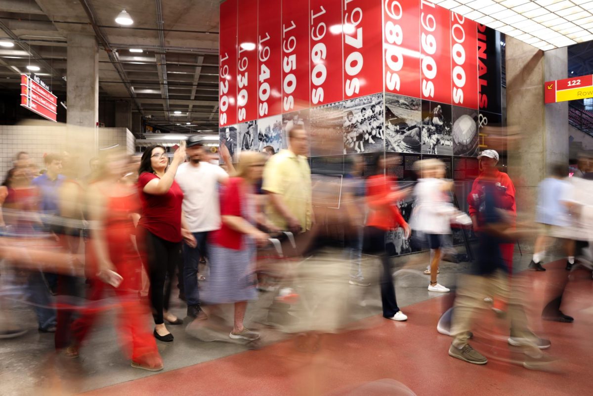 Memorial attendees quickly fill the halls of State Farm Stadium for the Charlie Kirk Memorial on Sept. 21 in Phoenix.