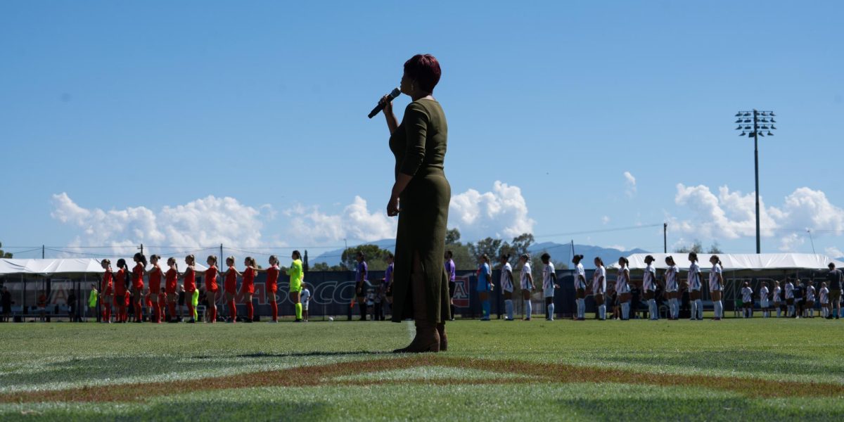 Robin Jackson sings “The Star-Spangled Banner” before the soccer game started at Murphey Field at Mulcahy Stadium in Tucson, Ariz. on Sept. 28.