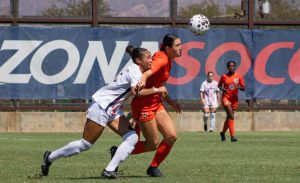 Trinity Dorsey attempts to get a hold of the soccer ball as she is blocked by opposing player at Murphey Field at Mulcahy Stadium in Tucson, Ariz. on Sept. 28.