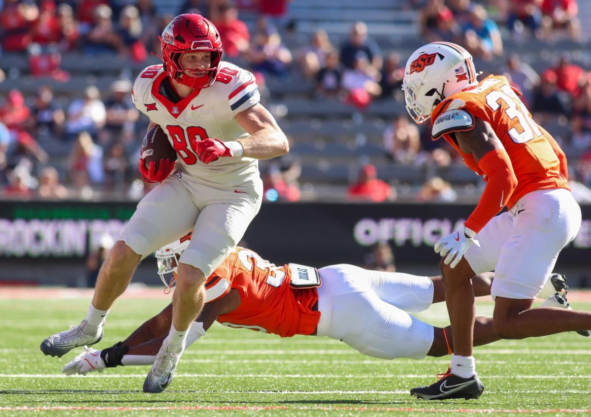 Cameron Barmore rushes vs Oklahoma State at Arizona Stadium on Oct. 4.
