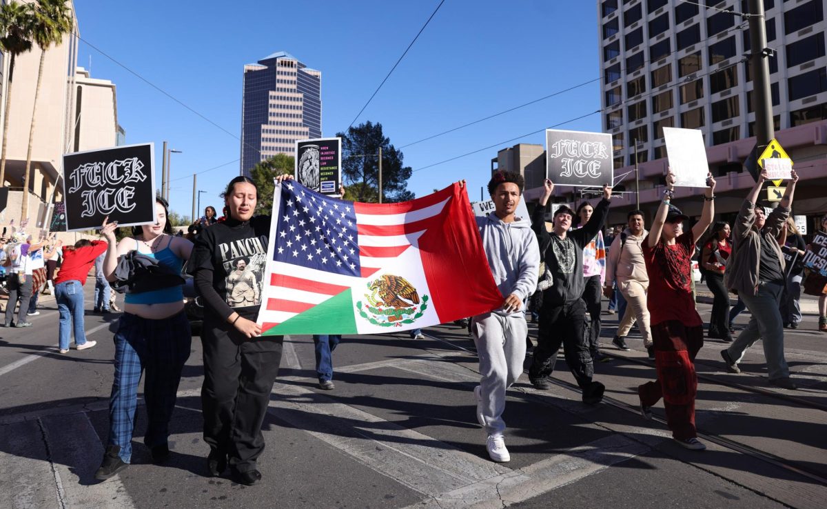 Protestors take over Congress Street in downtown Tucson on Jan. 20.