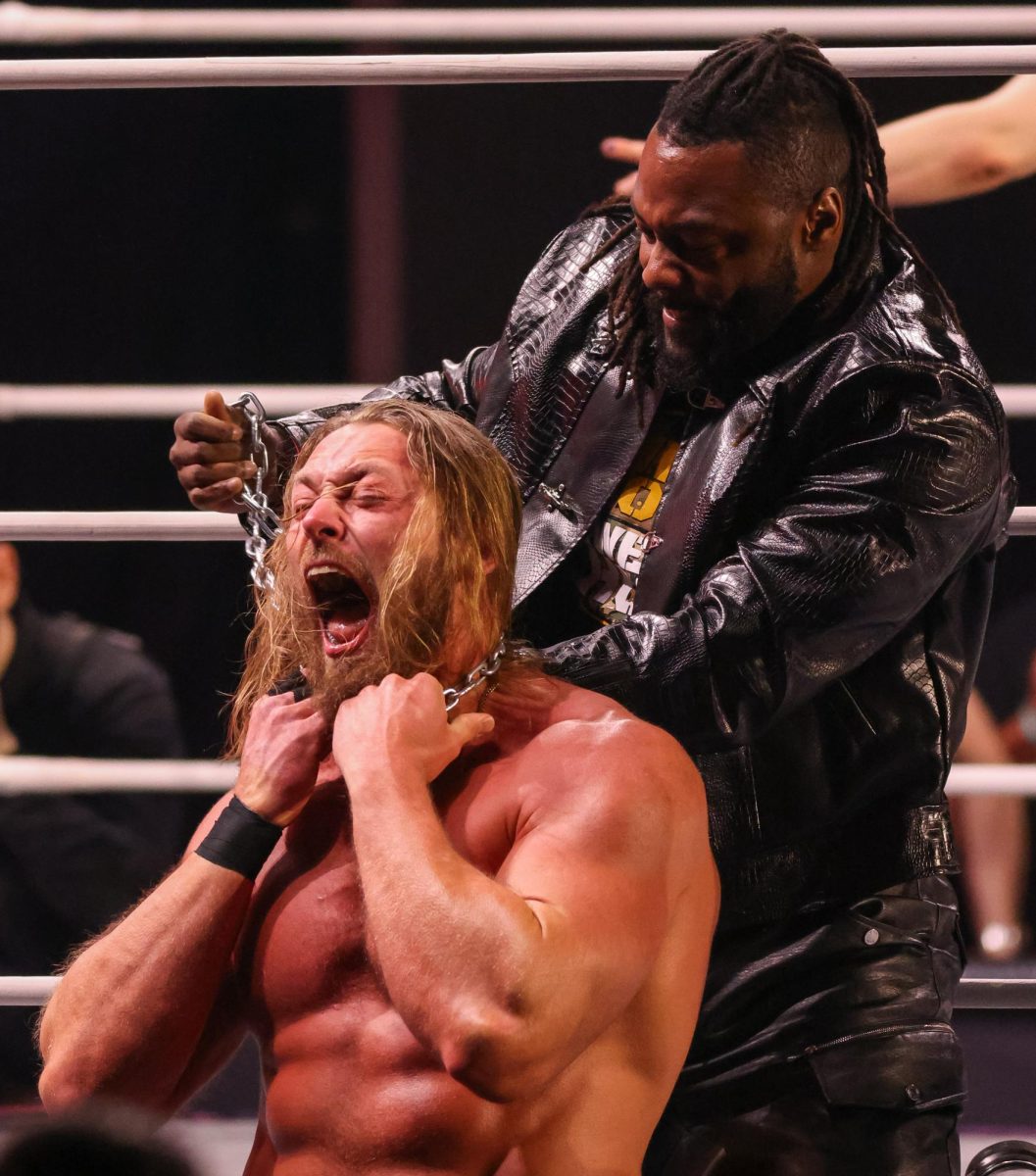 Swerve Strickland wraps a steel chain around the neck of Big Bill to prevent a match interference in Arizona Financial Theater in Phoenix on Jan. 14.