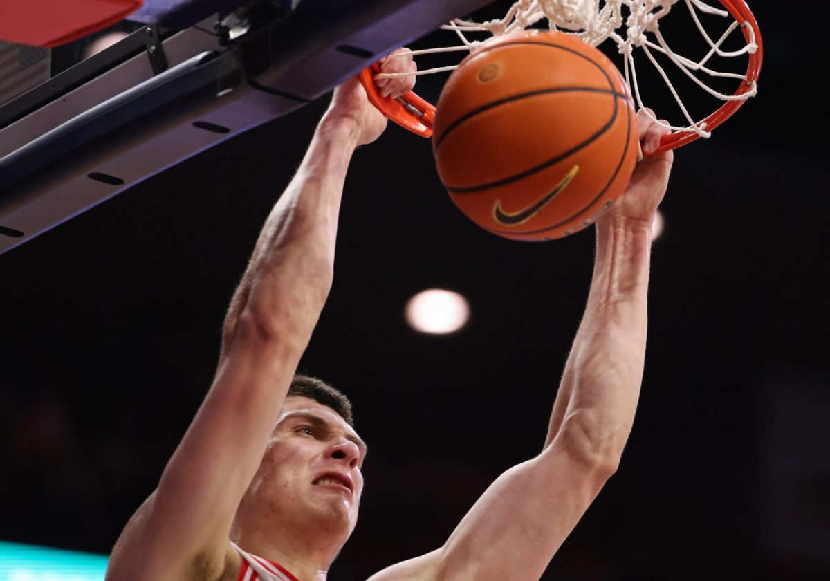 Ivan Kharchenkov dunks the ball against Kansas State in McKale Center on Jan. 7.