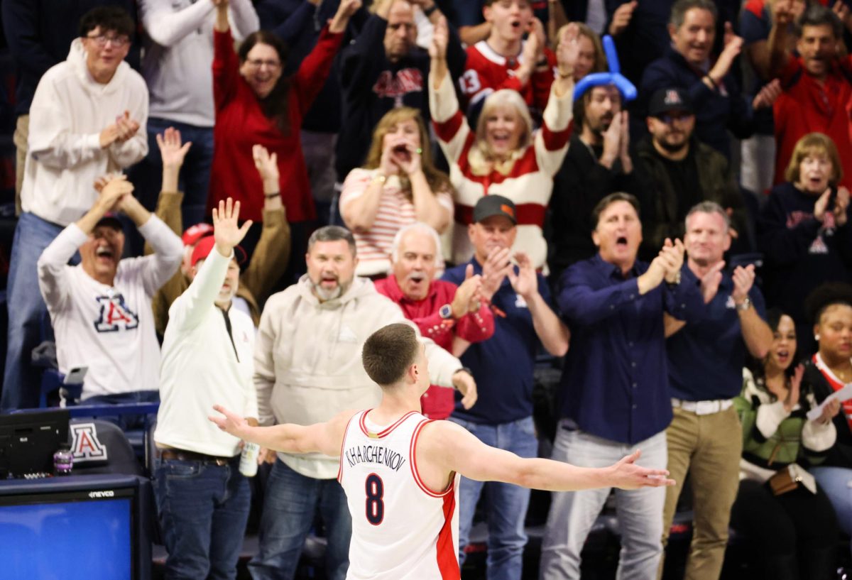 Ivan Kharchenkov hypes the crowd up during their game against Cincinnati in McKale Center on Jan. 21.