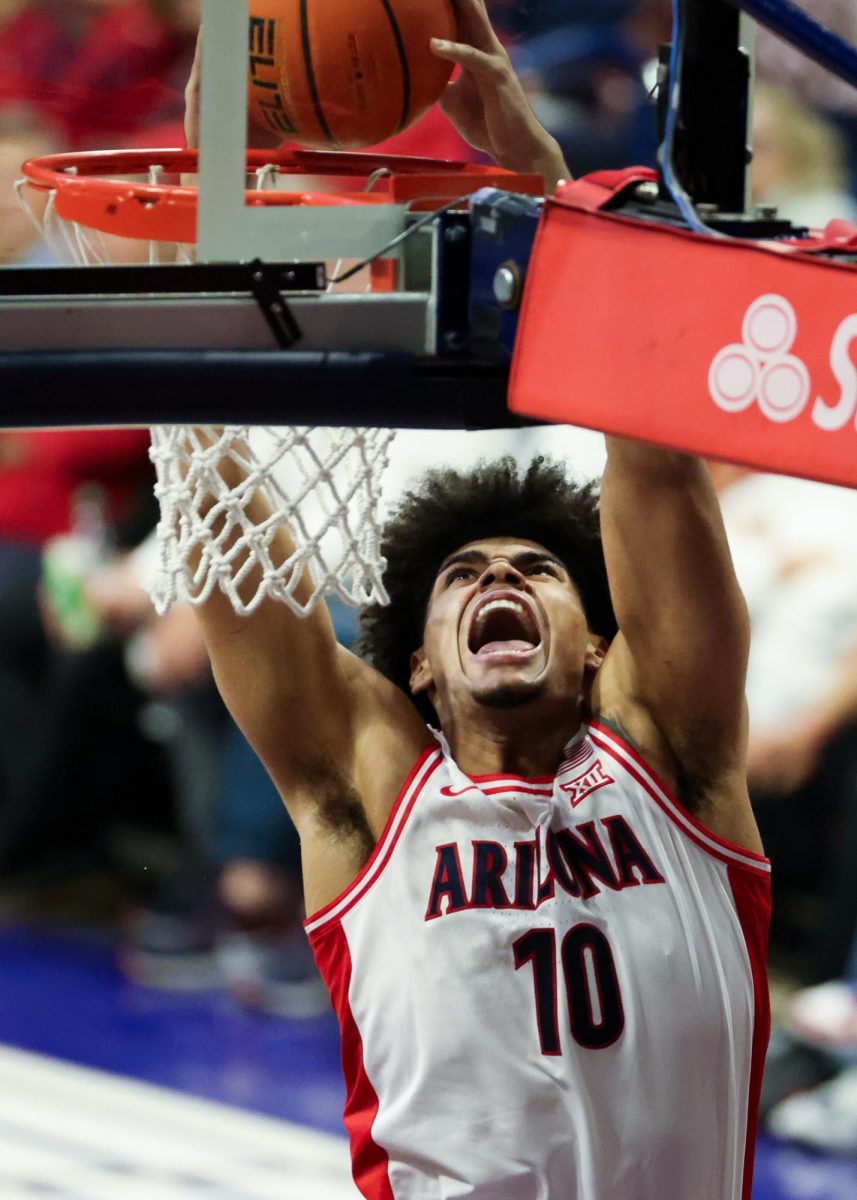 Koa Peat dunks the ball against Cincinnati in McKale Center on Jan. 21.