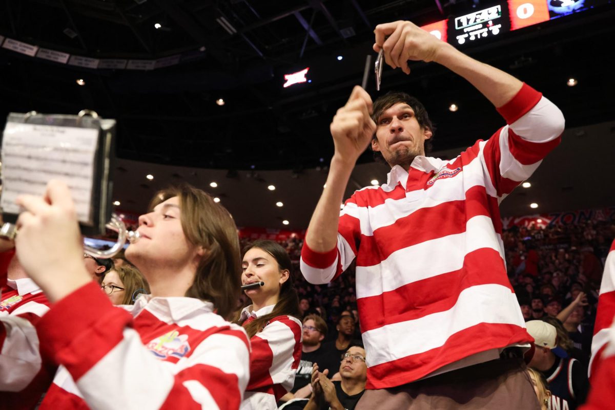 Boban Marjanović thrashes his triangle while playing with the Pride of Arizona in McKale Center at ALKEME Arena on Feb. 18.
