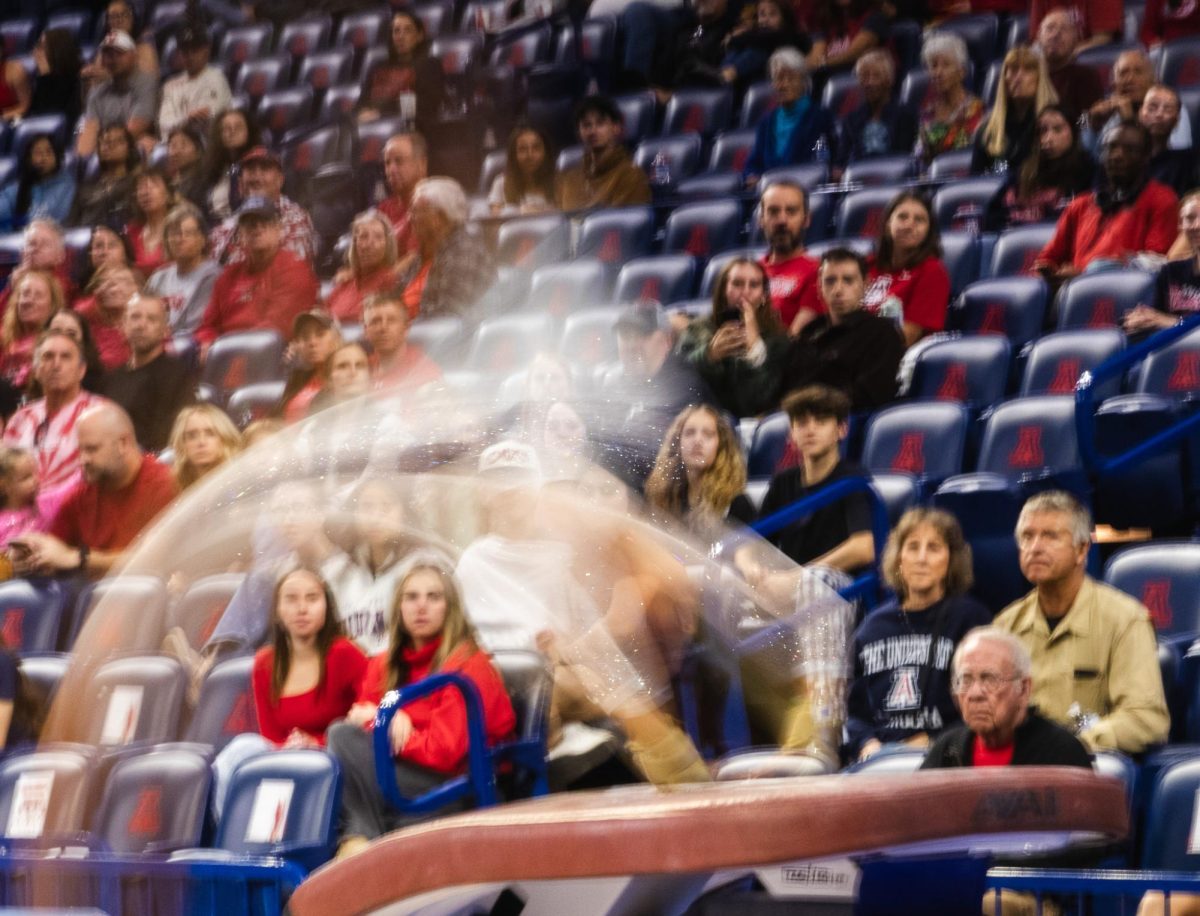 An Arizona gymnast performs their vault routine against Utah in McKale Center on Feb. 6.