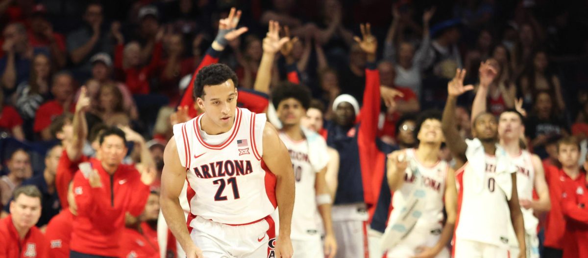 The crowd, and bench, goes wild for Evan Nelson (21) as he scores a deep three, the first of five points he will score off the bench in a home game against Oklahoma State University on Jan 7, 2026.