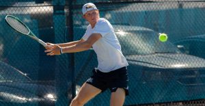 Filip Gustafsson returns a shot during singles play against Baylor on March 20 at the LaNelle Robson Tennis Center.