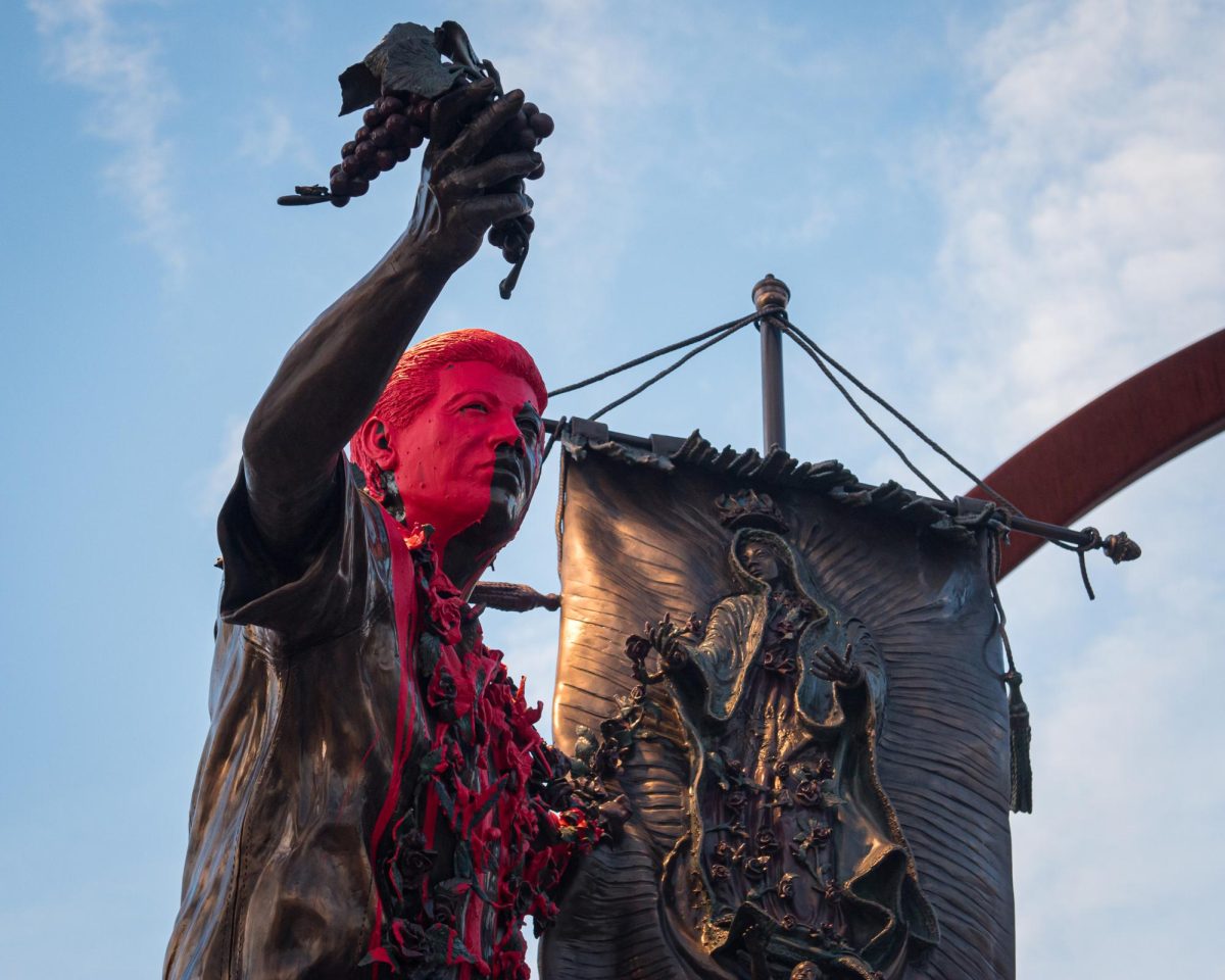 A statue of César Chávez is seen vandalized with red paint at the Five Points intersection on March 22. The vandalism comes amid recent allegations of sexual misconduct against the labor leader.