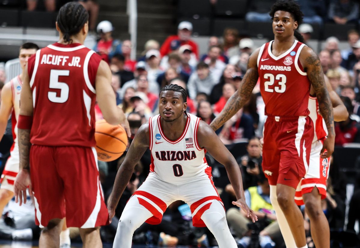 Jaden Bradley (0) eyes up an Arkansas player as he looks to move towards the basket on March 26 in SAP Center in San Jose.