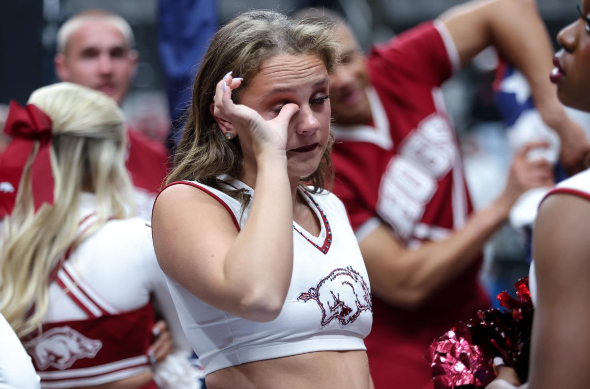 An Arkansas cheerleader cries with her team after losing in the Sweet 16 round of March Madness against Arizona in SAP Center in San Jose on March 26.