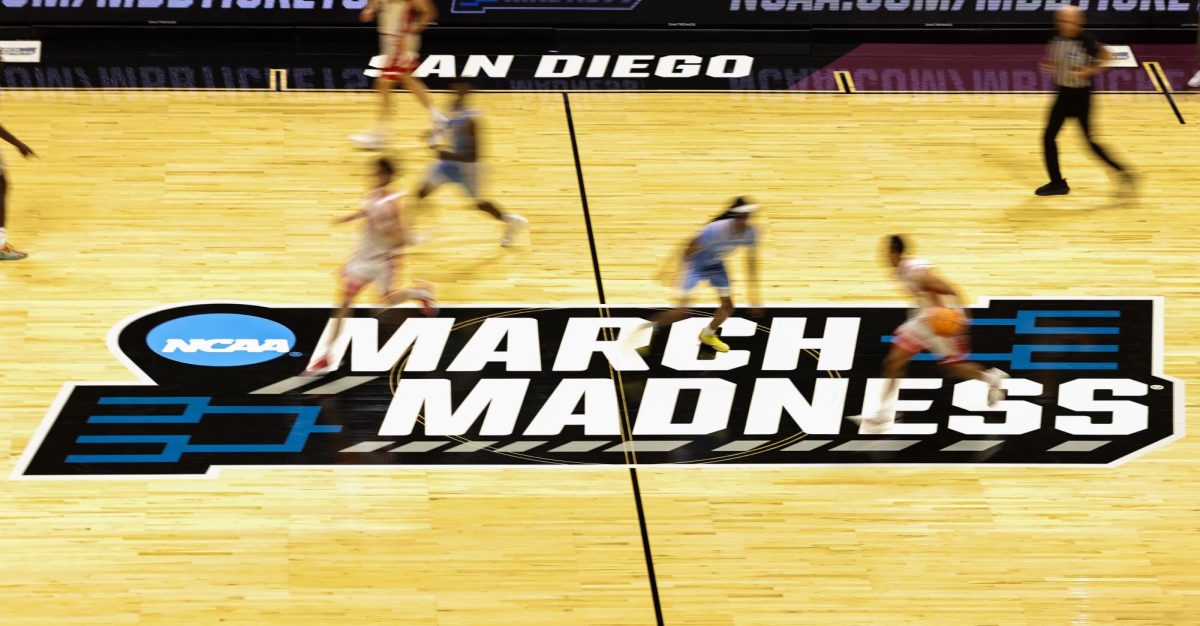 Evan Nelson dribbles the ball up the court against LIU in San Diego on Mar. 20.