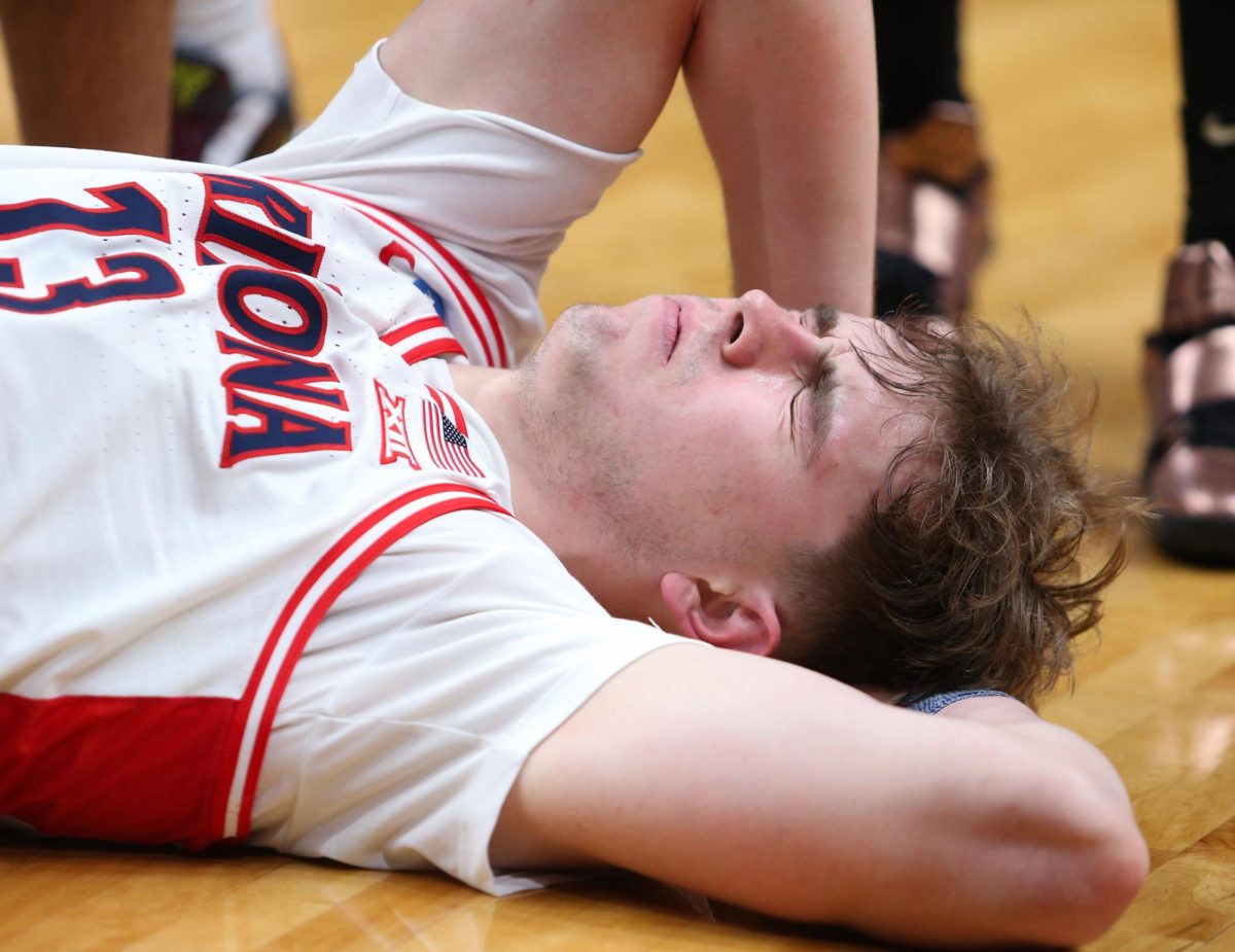 Motiejus Krivas lies on the floor after smacking his head against the hardwood during Arizona's Elite Eight matchup against Purdue University on March 28 in SAP Center in San Jose, California.