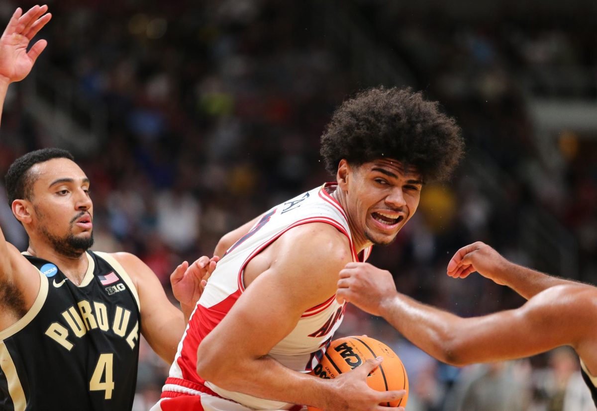 Koa Peat fights through contact against Purdue on March 28 in SAP Center in San Jose.