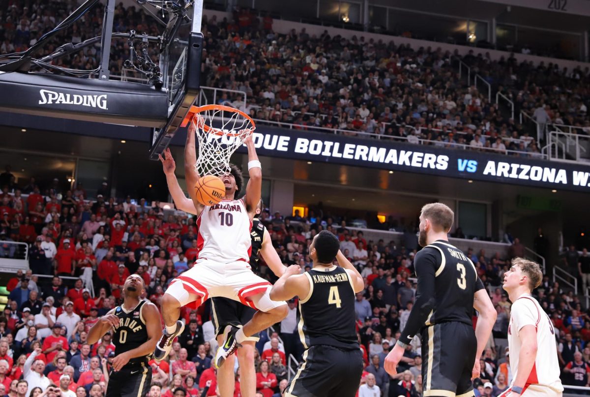 Koa Peat dunks the ball during Arizona's Elite Eight matchup against Purdue University on March 28 in SAP Center in San Jose, California.