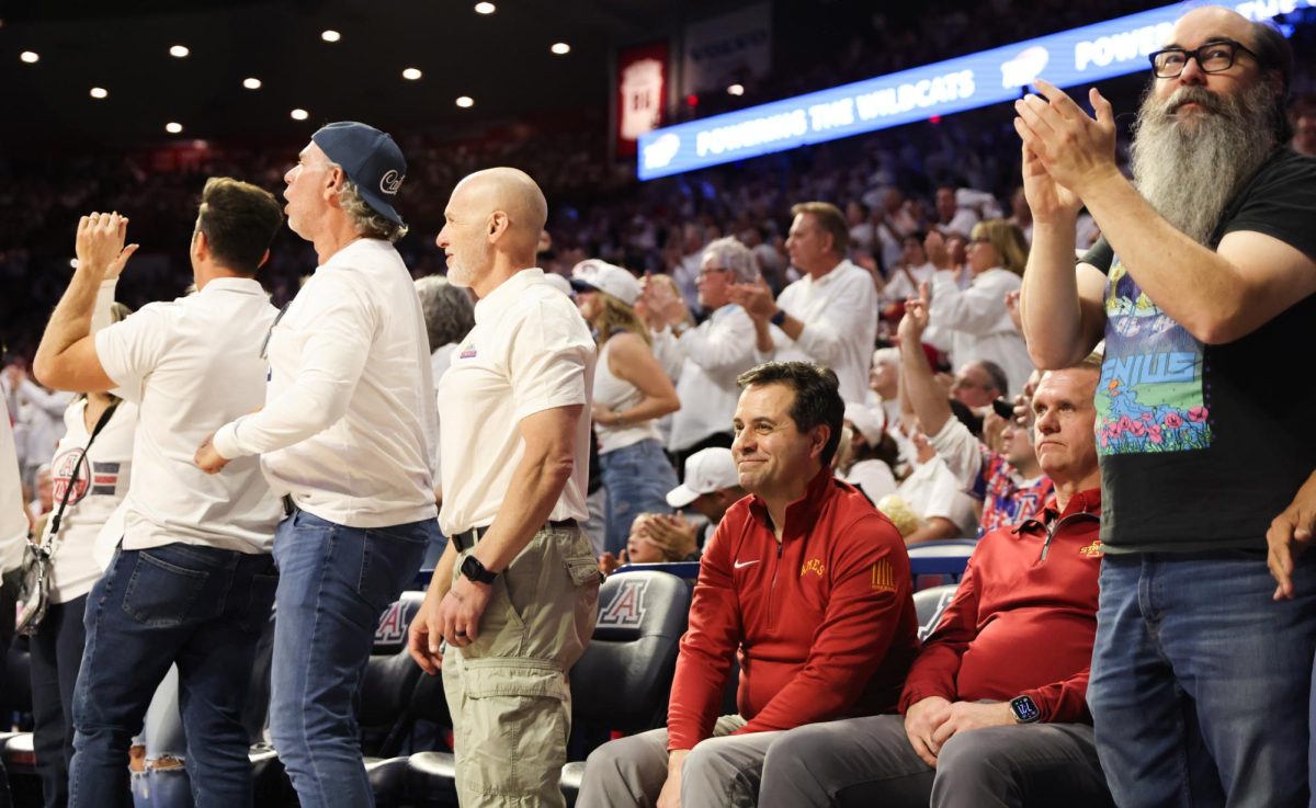 Two Iowa State fans sit down after an Arizona three pointer in McKale Center on Mar. 2.