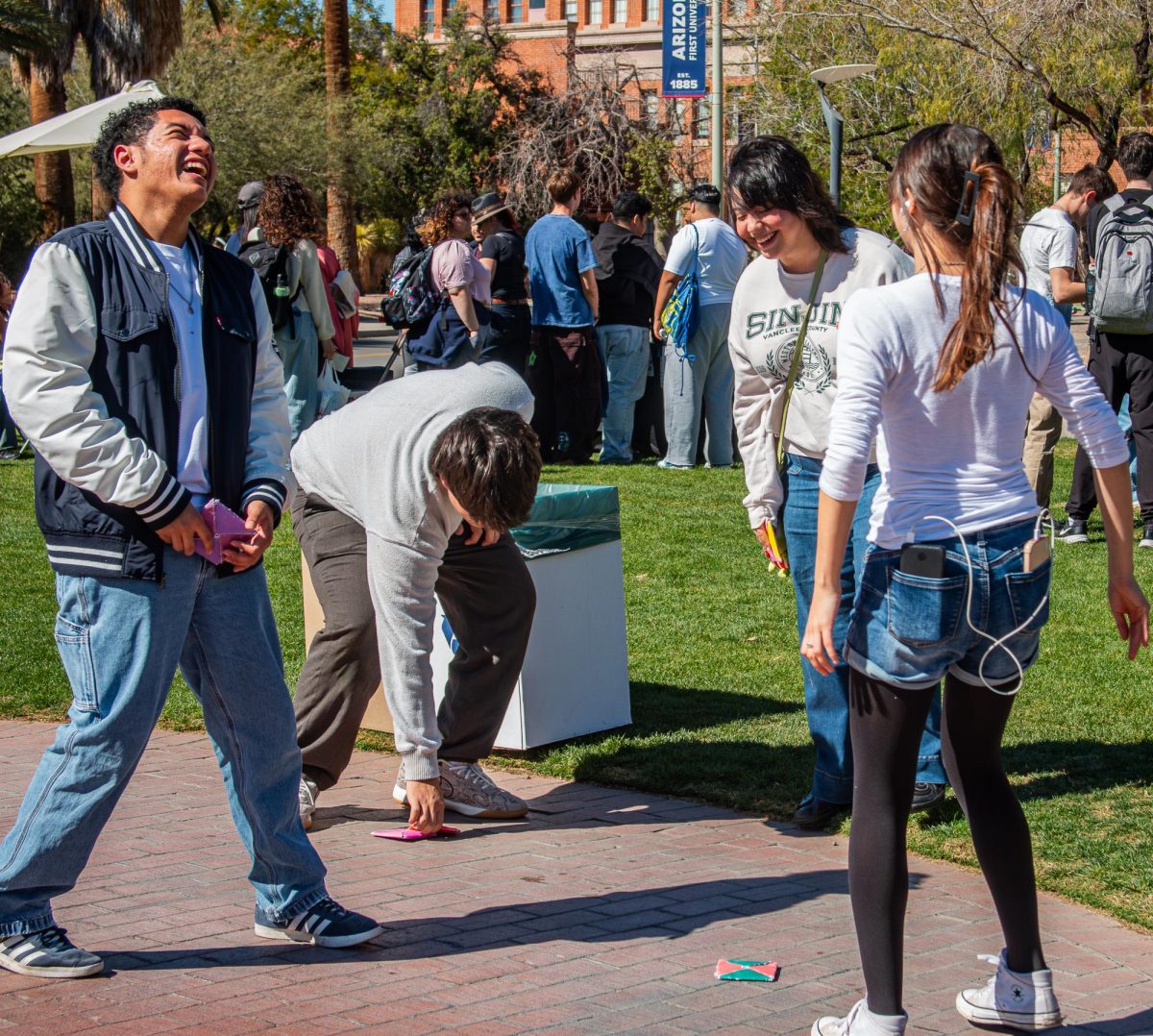 Students play ddakji during the East Asian Language & Culture Festival on Feb. 18 on the UA mall.
