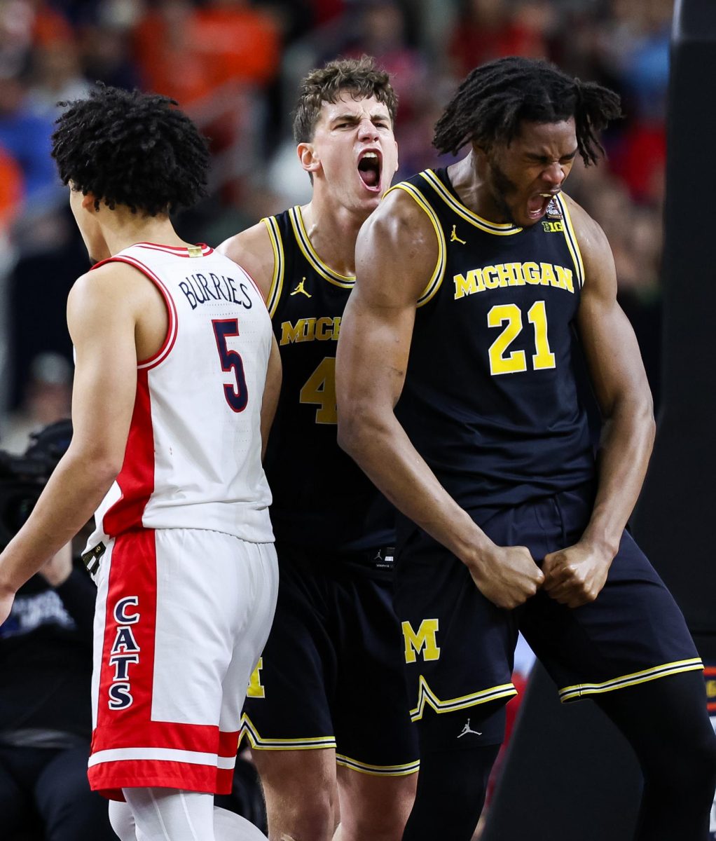 Morez Johnson Jr. celebrates a dunk against the University of Arizona in Lucas Oil Stadium in Indianapolis on April 4.