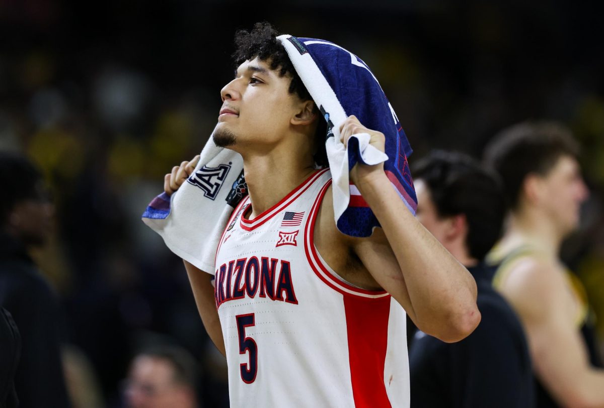 Brayden Burries walks off the court following a loss to the University of Michigan in Lucas Oil Stadium in Indianapolis on April 4.