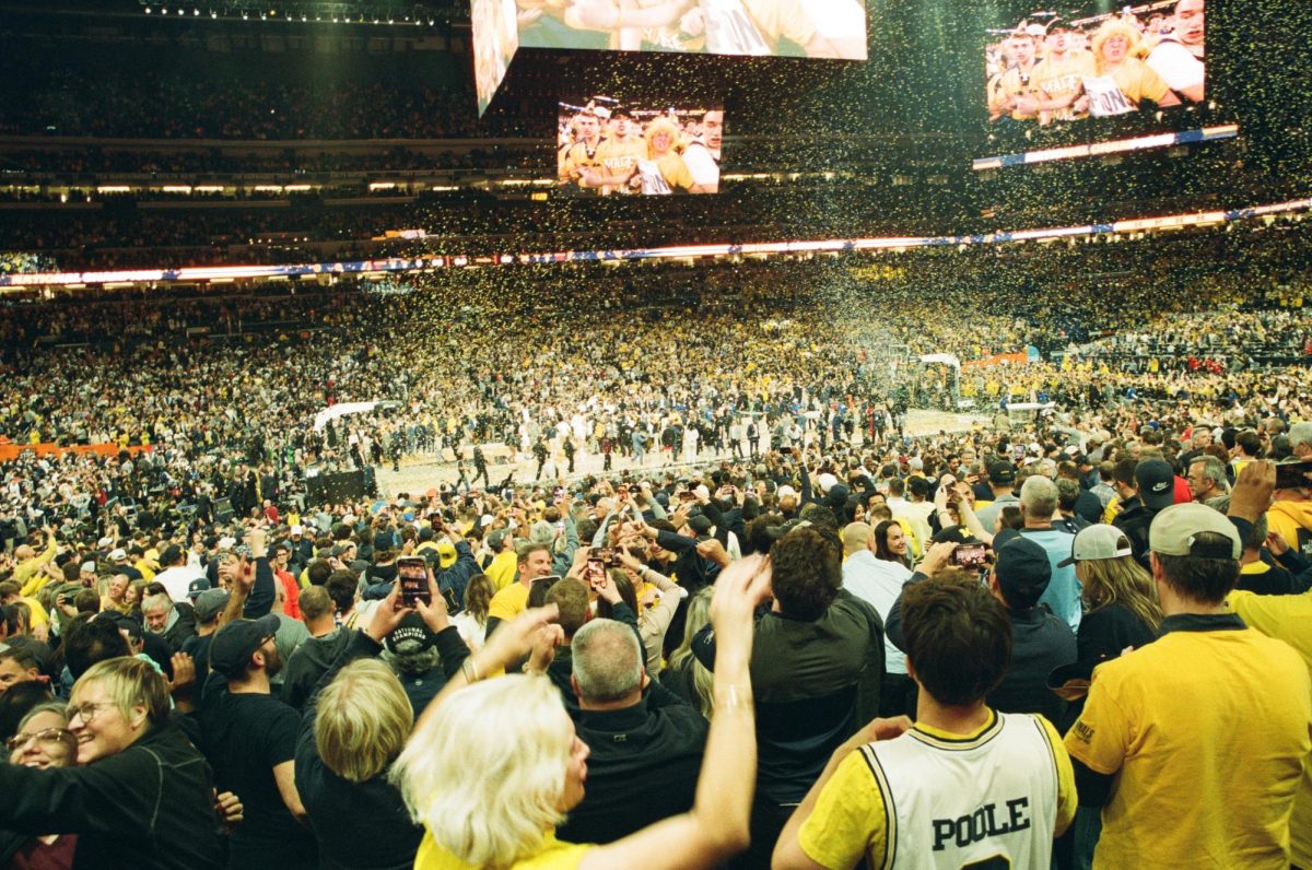 Confetti falls while fans celebrate the University of Michigan winning the NCAA Division I Men’s Basketball National Championship in Lucas Oil Stadium in Indianapolis on April 6.